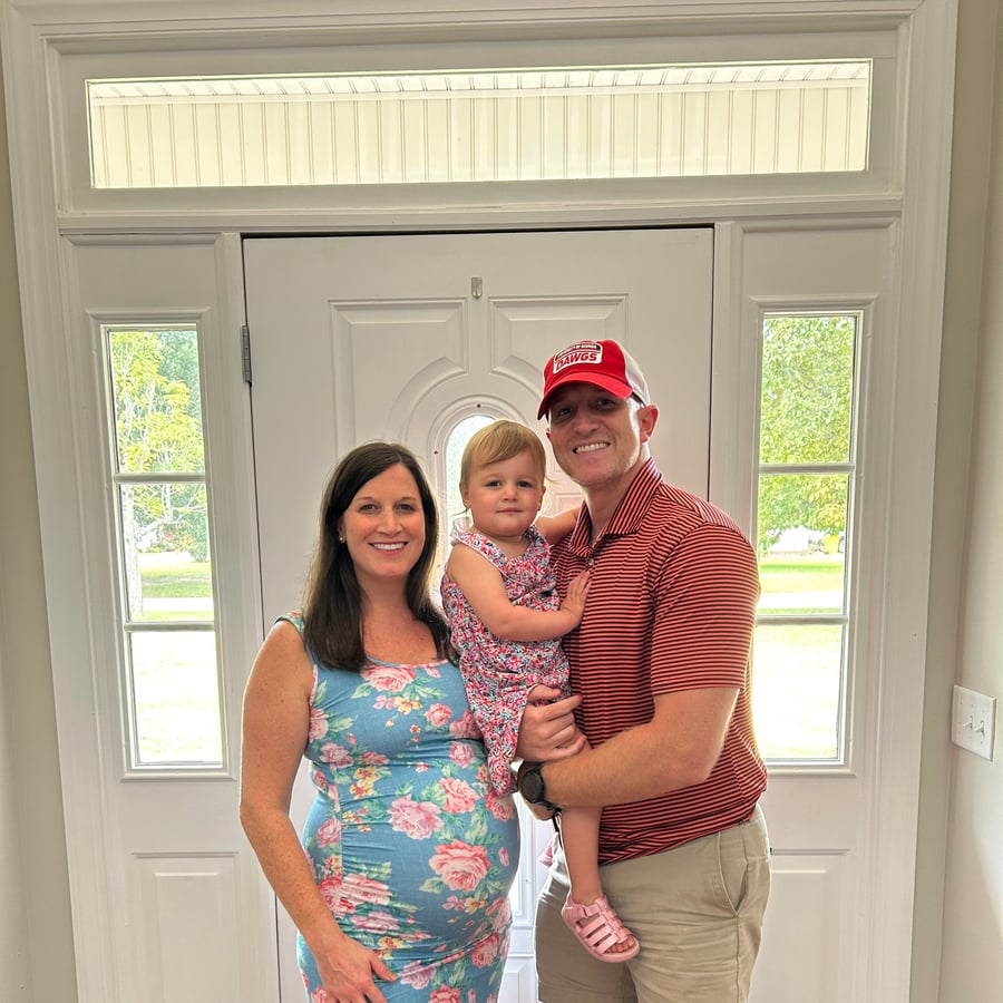 Dr. Nicole McDonald and her family at their front door in Bremen
